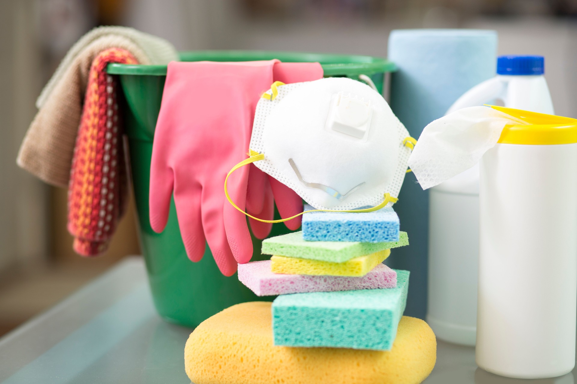 Gloves, sponges and disinfectant to clean office and desk surface